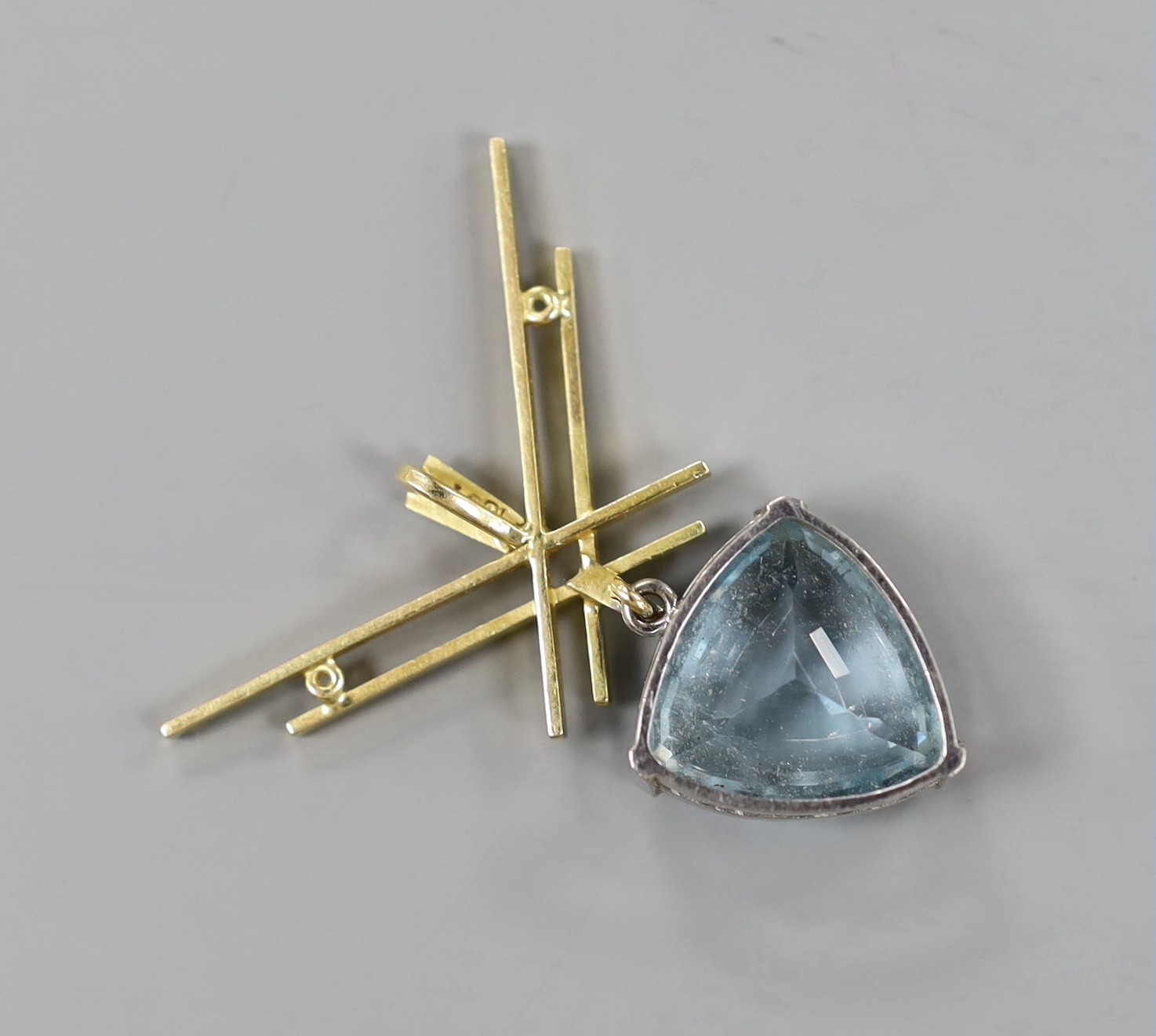 An 18ct and triangular cut aquamarine set drop pendant , overall 43mm, gross weight 10.8 grams.